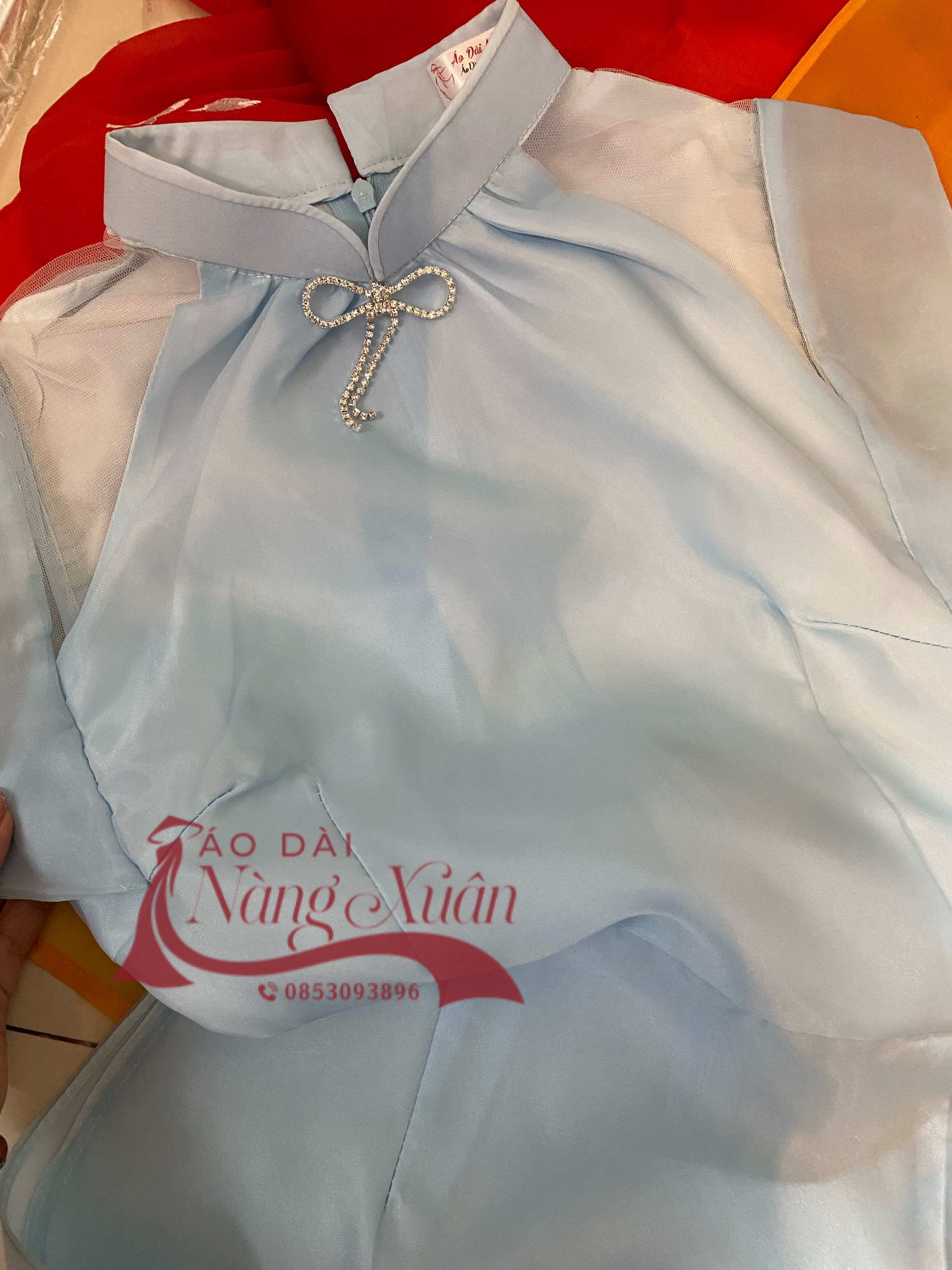 ao-dai-nu-ha-lam-mau-xanh-chat-lieu-to-ong (5)